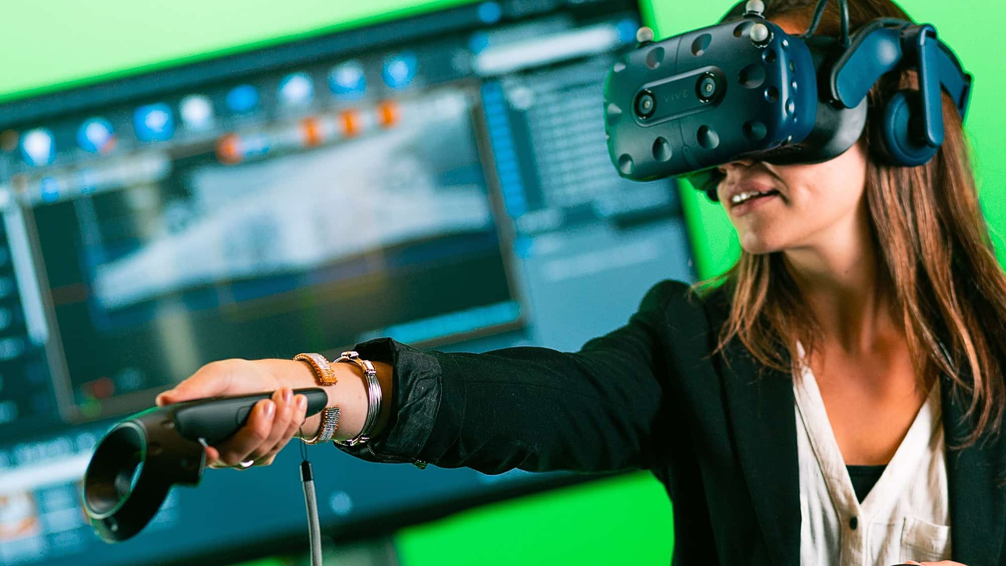 Woman immersed in virtual reality environment using headset and motion controller for interaction