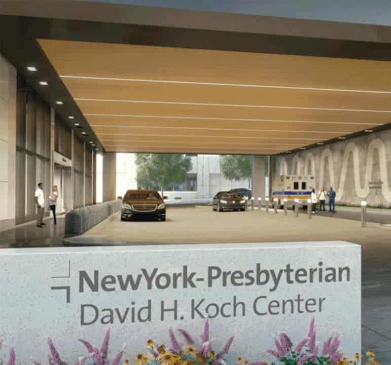 NewYork-Presbyterian David H. Koch Center entry with cars under wide wooden canopy