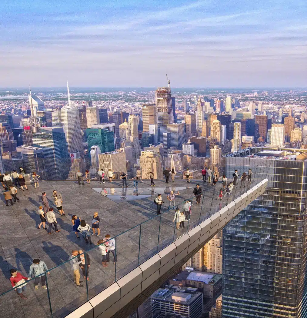Visitors standing on Edge’s outdoor platform, admiring a wide-angle view of Manhattan