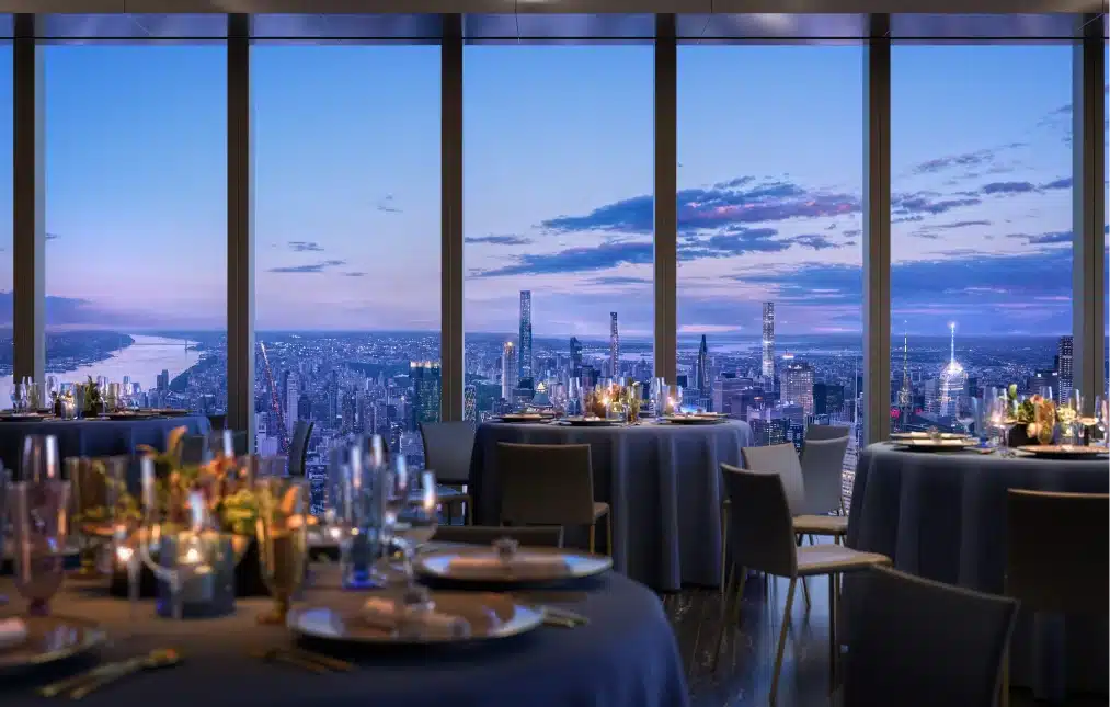 Elegant dining setup at Peak restaurant, featuring a candlelit ambiance and stunning city views