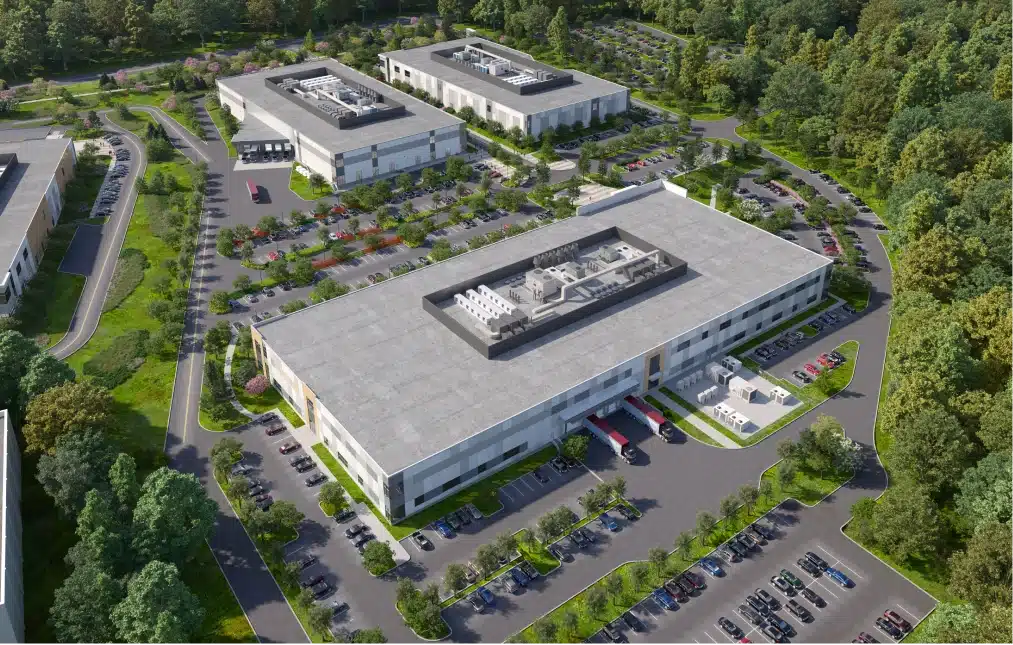 Modern biotech facility with state-of-the-art infrastructure, green surroundings, and office buildings