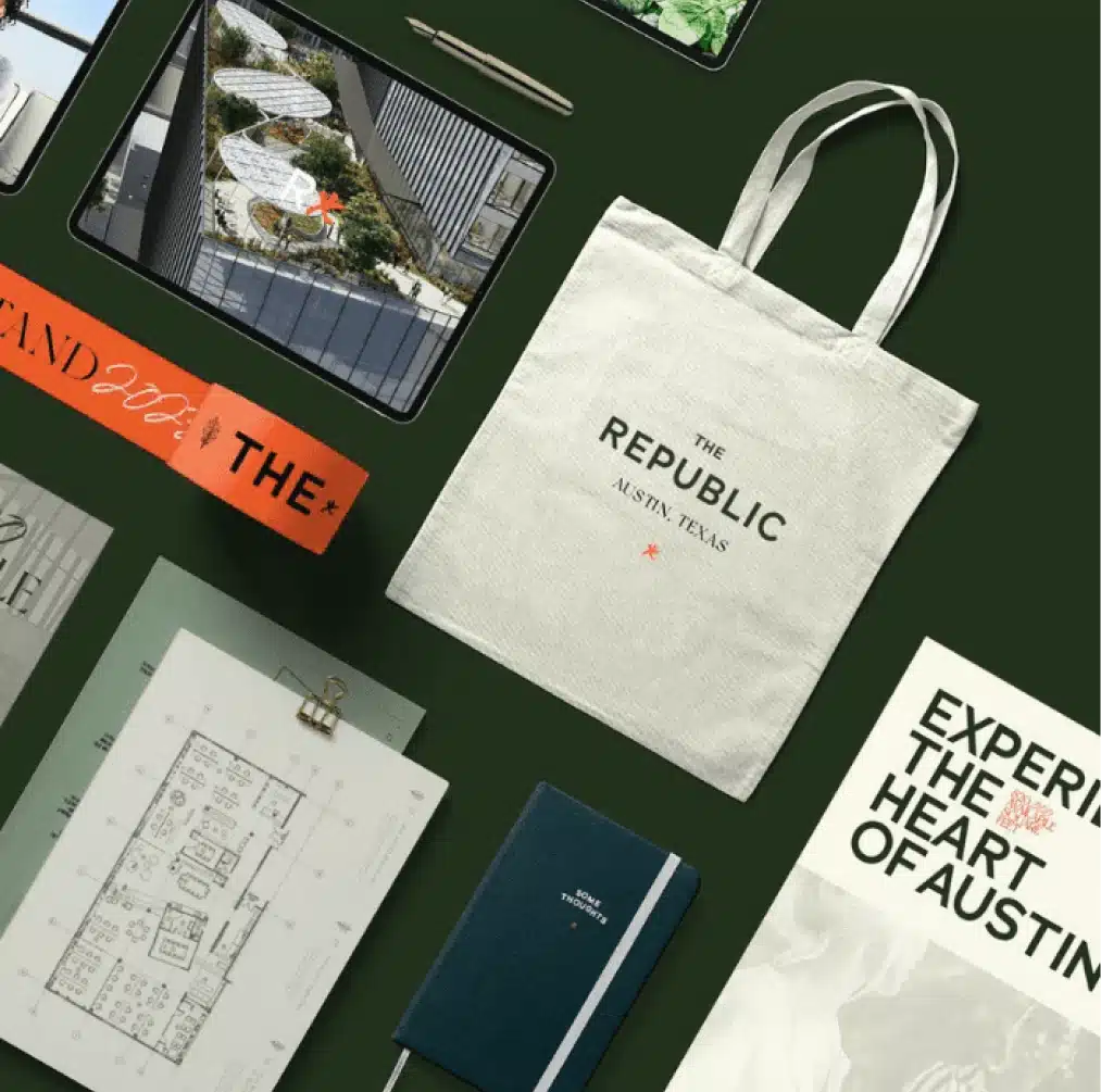 Branded tote bag and promotional materials for The Republic Austin on a dark green background