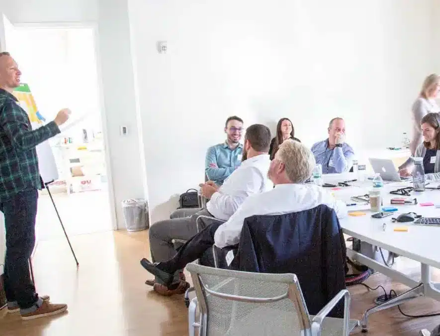 Business team engaged in a strategy session, collaborating around a modern conference table