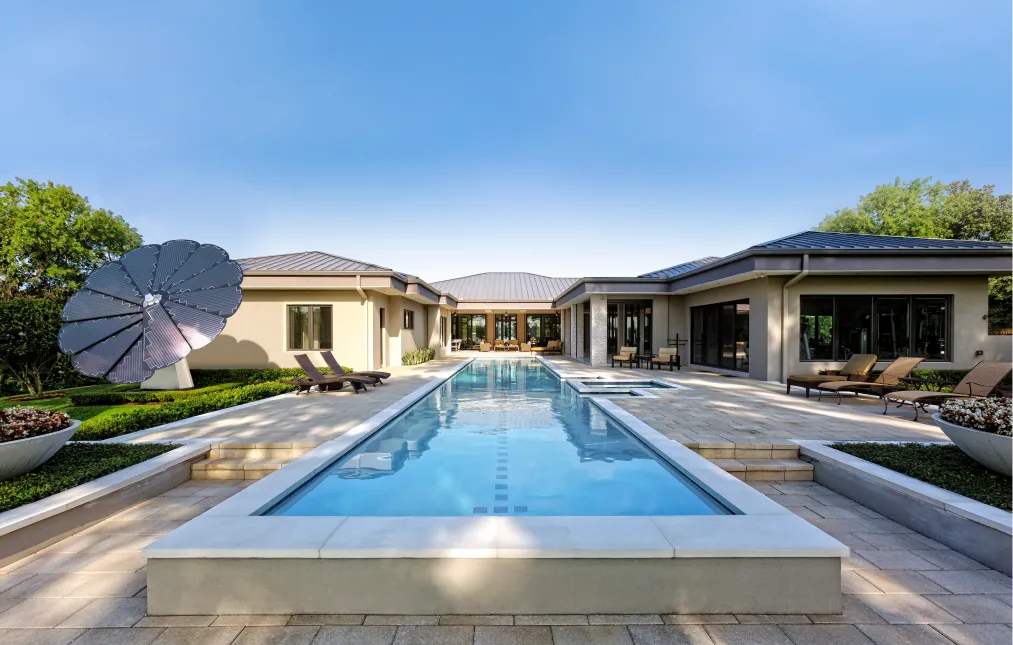 Modern residence featuring a poolside SmartFlower solar panel, integrating renewable energy into home design