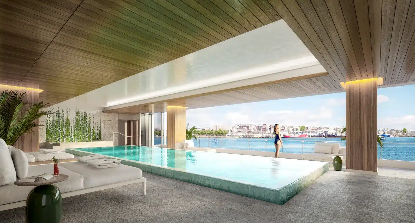 Serene infinity pool with city skyline views and relaxing lounge seating