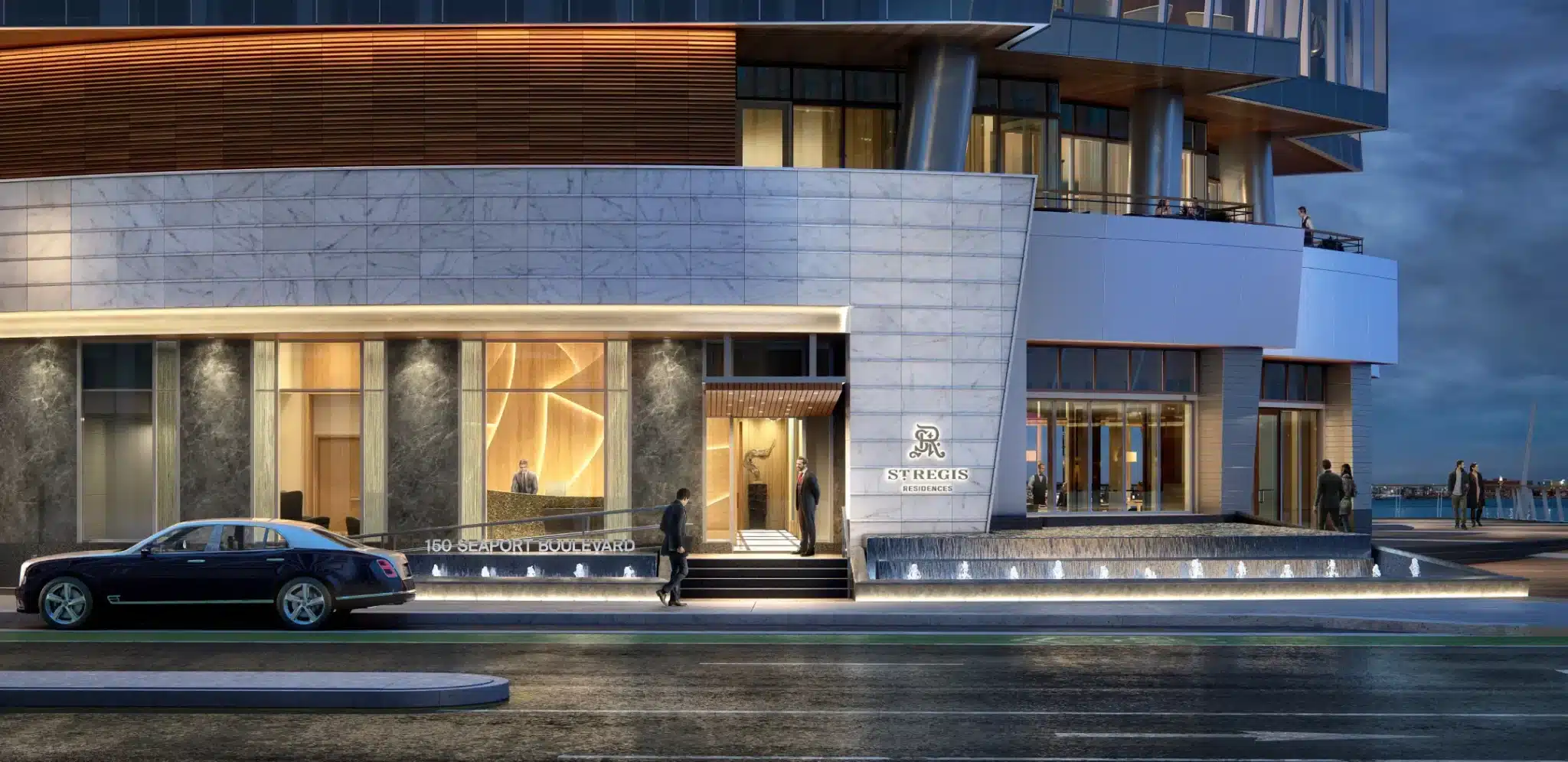 St. Regis Residences' illuminated entrance with luxury design and modern architectural elements