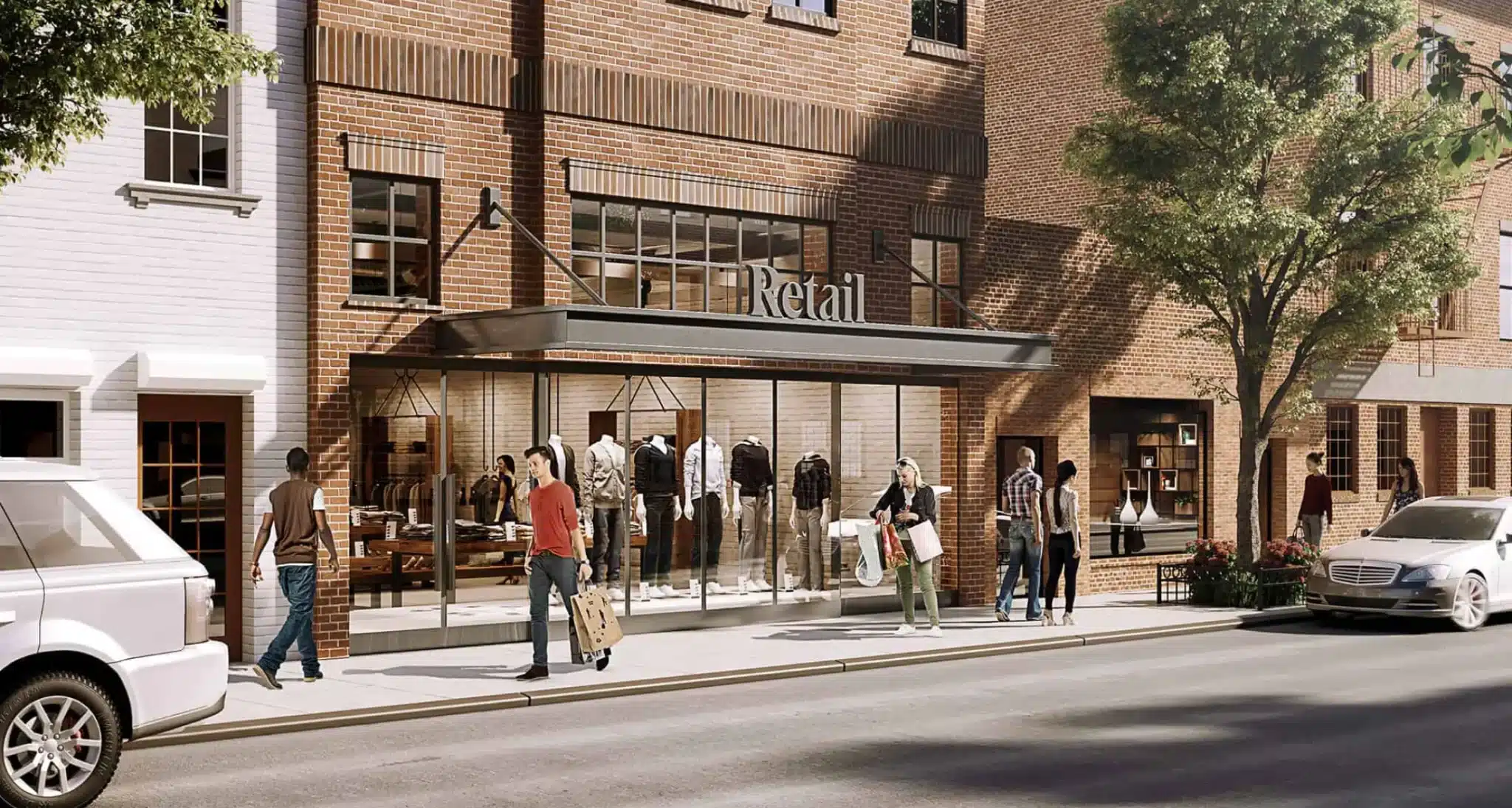 Brick retail storefront with glass windows, mannequins, and pedestrians walking along the sidewalk