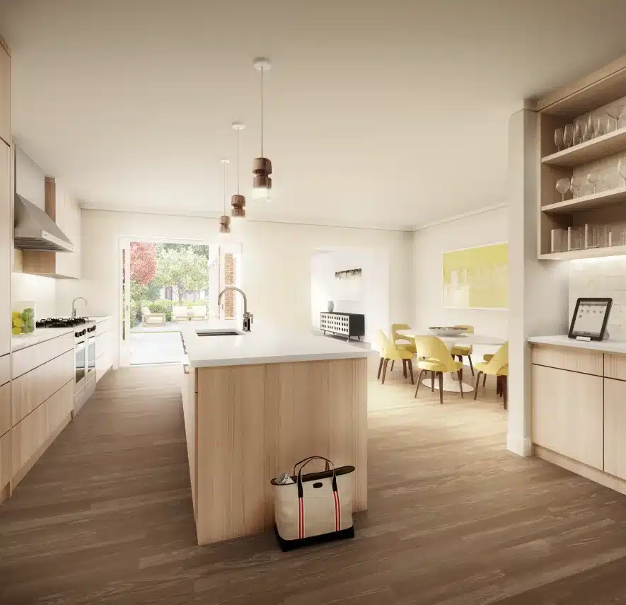 Modern kitchen with wooden cabinets, pendant lighting, and an open view to a lush backyard