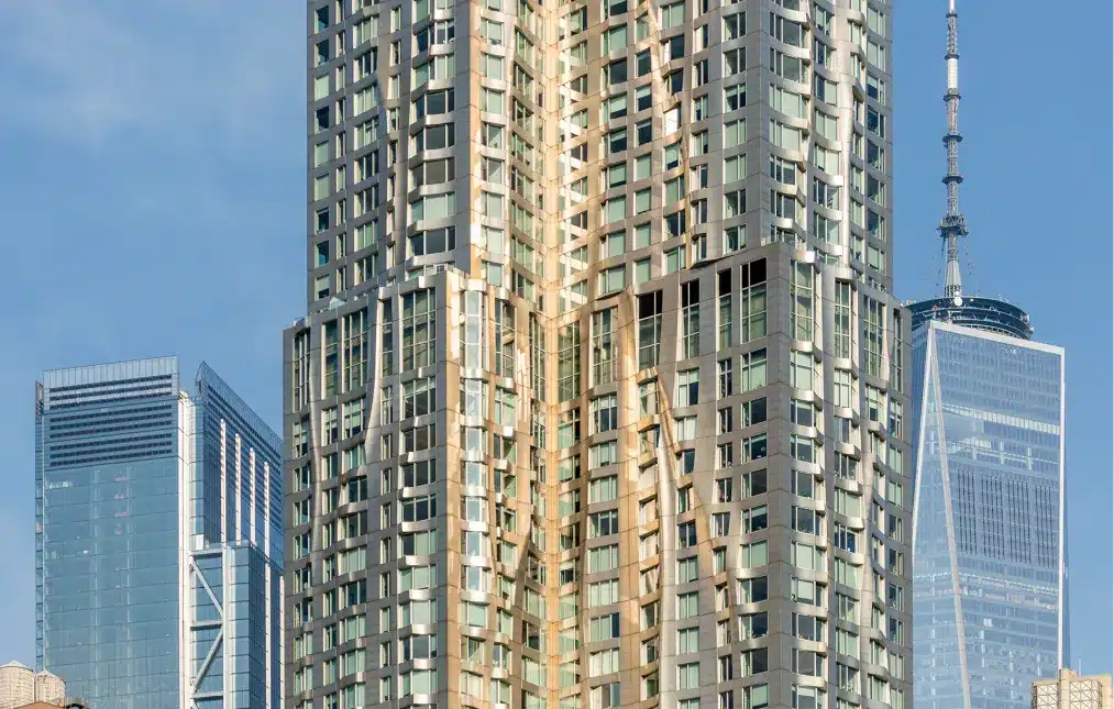 Close-up of a modern high-rise building with reflective windows and architectural details