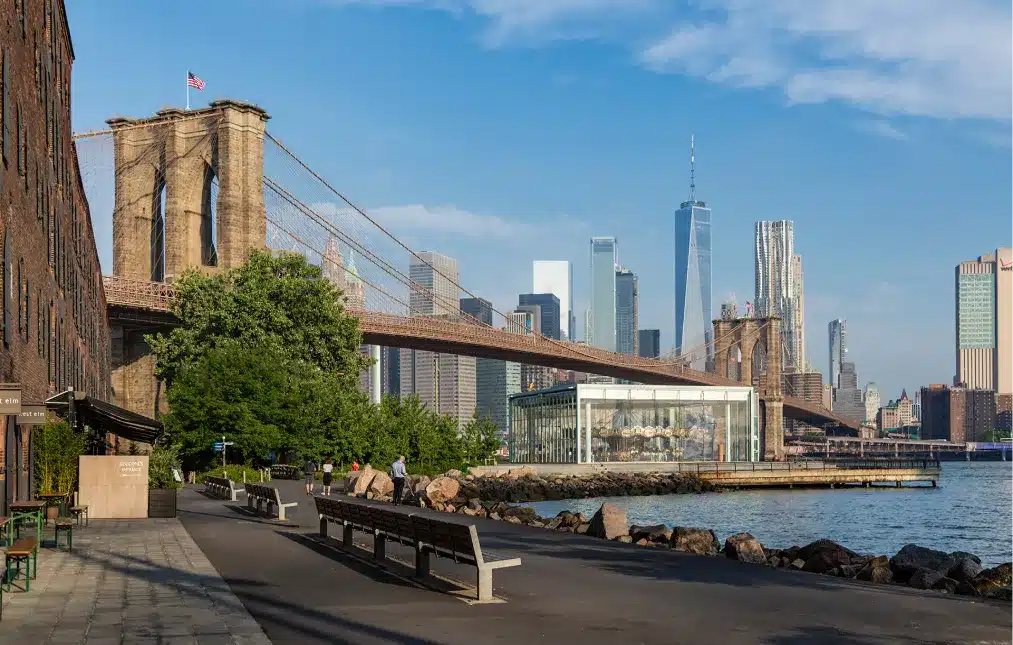 Brooklyn Bridge with the Manhattan skyline in the background on a clear sunny day