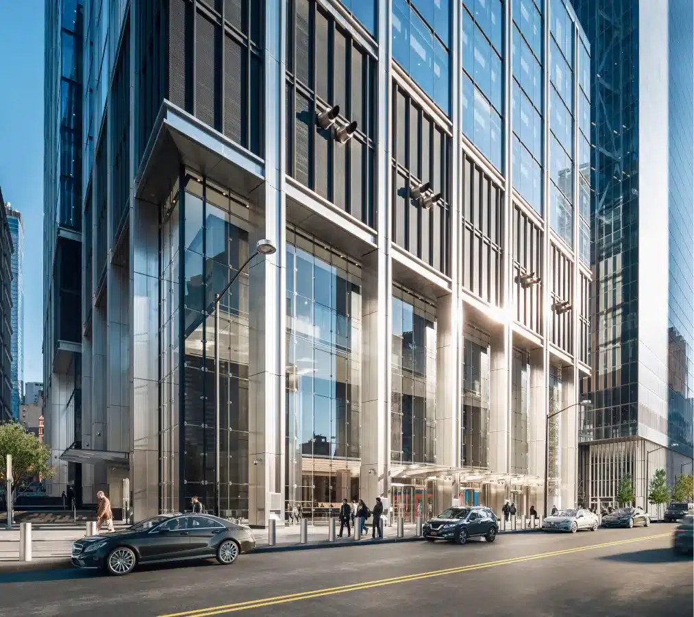 The sleek glass facade of 3 World Trade Center reflecting the urban skyline