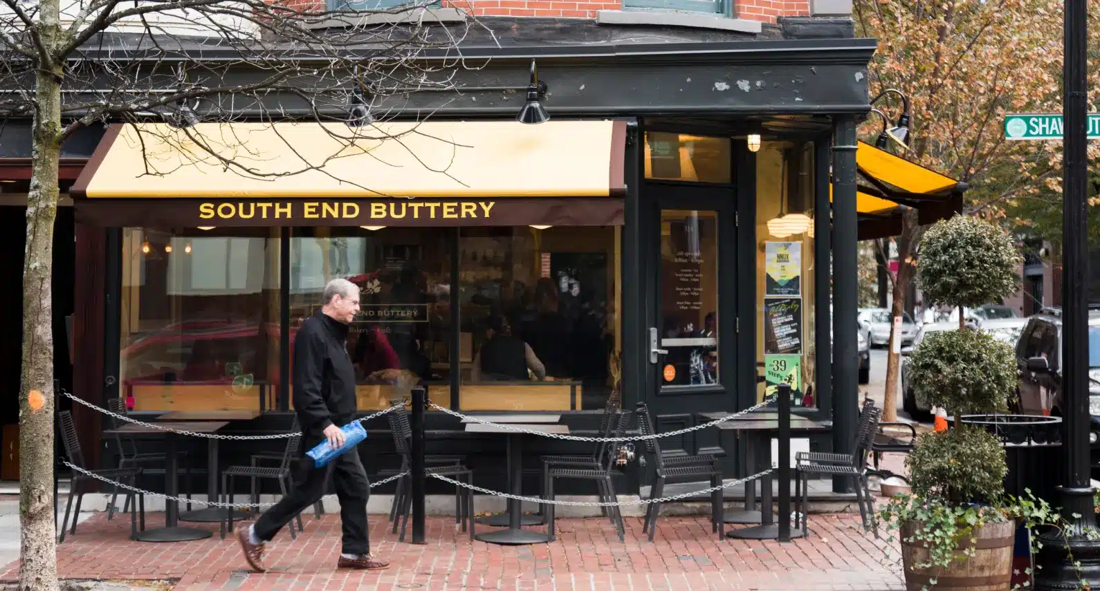 South End Buttery café storefront with a warm yellow awning and inviting atmosphere