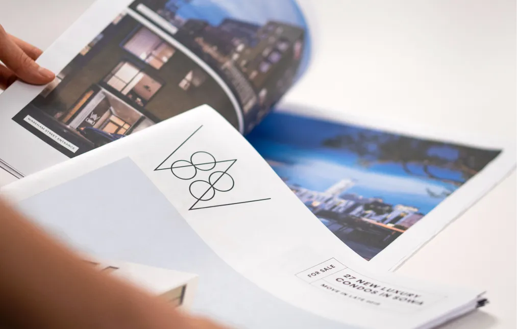 High-end property brochure with sleek branding and images of premium Boston condominiums