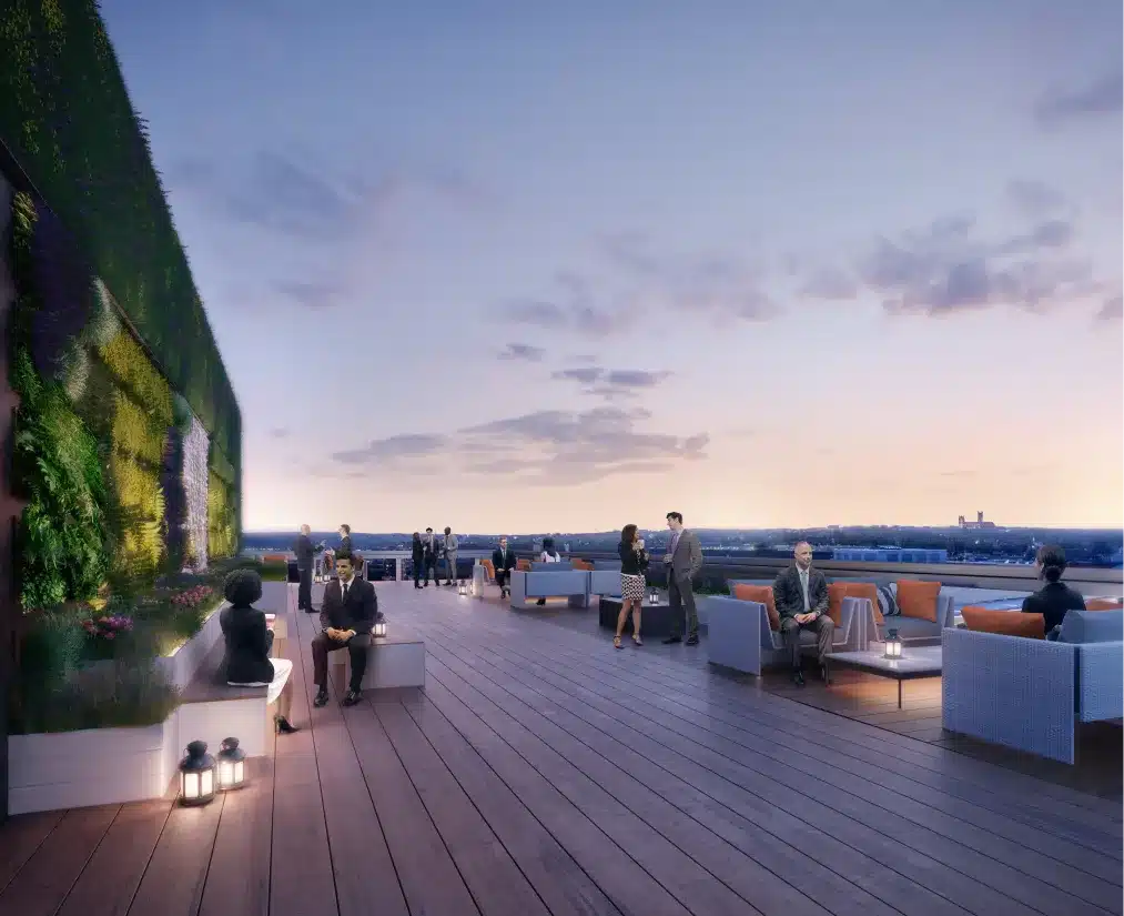 Rooftop lounge at Alexander Court with stylish seating and sunset cityscape views