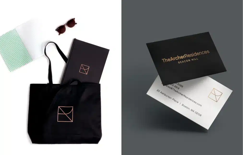 Branded merchandise set featuring a tote bag, luxury packaging, and elegant gold-accented business cards