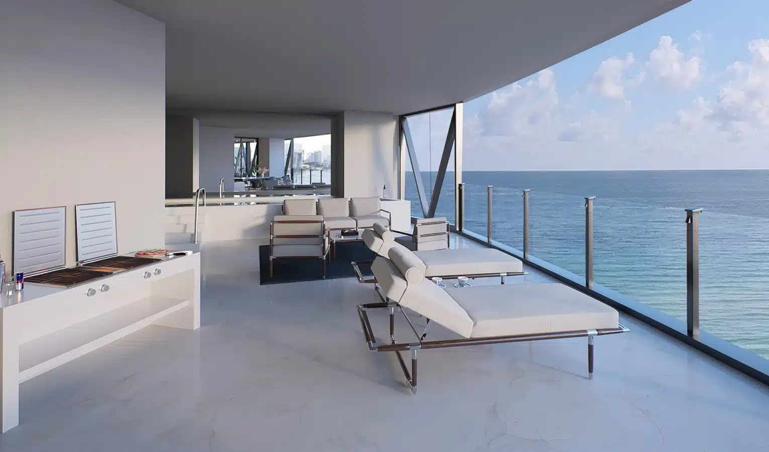 Luxury penthouse terrace with ocean views, modern lounge chairs, and a built-in outdoor kitchen