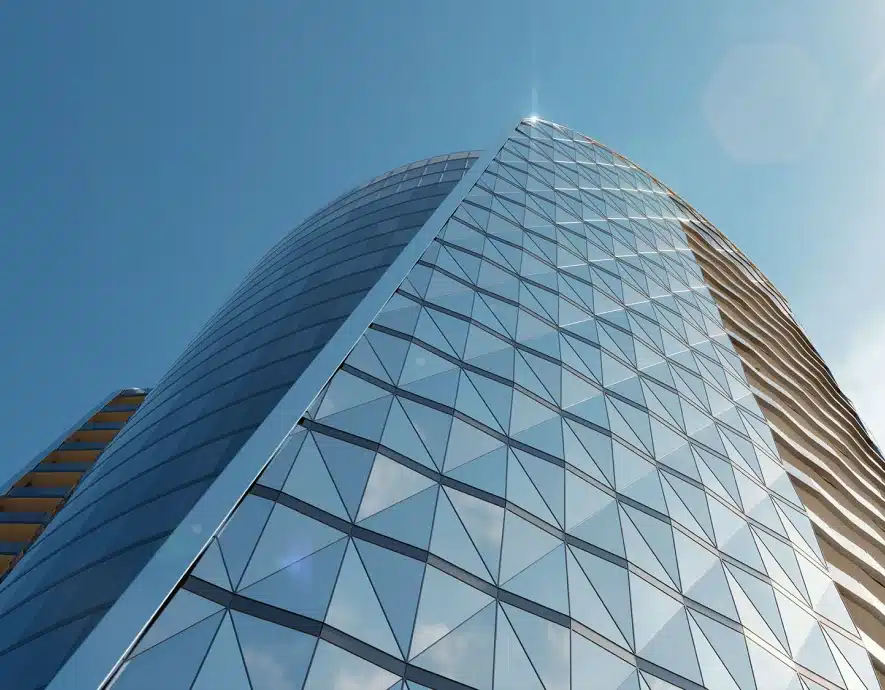 Close-up view of Bentley Residences' intricate geometric glass facade and sleek modern design