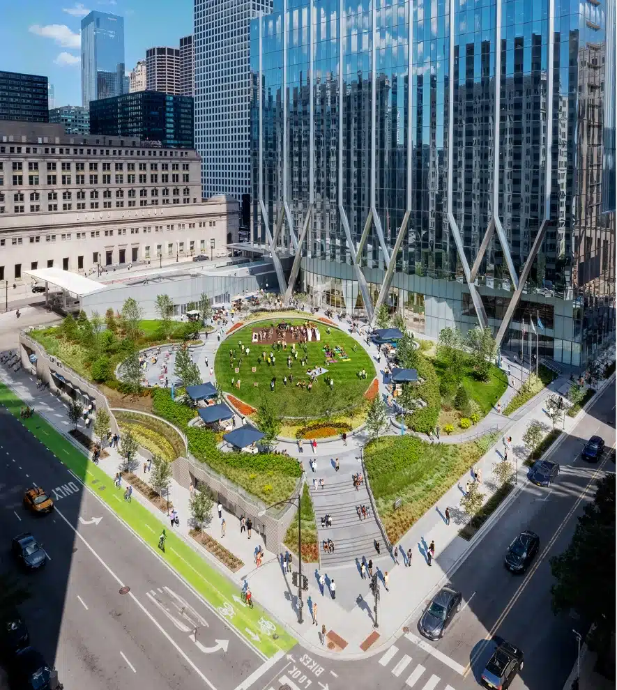 Aerial view of The Green at 320 showing landscaped park, bike lanes, and active pedestrian scene
