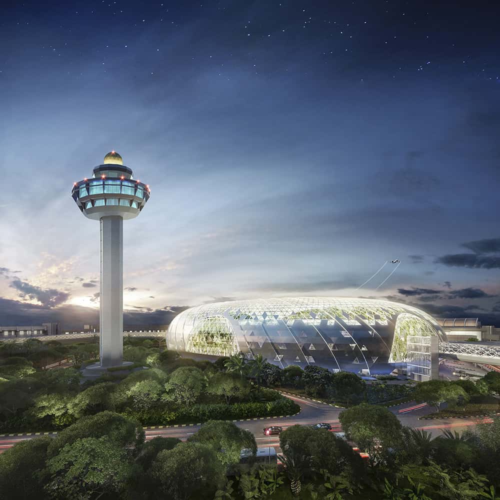 Air traffic tower and futuristic biodome set against dramatic evening sky and landscape