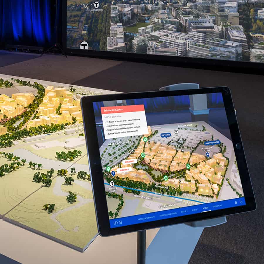 Interactive tablet displays 3D site plan of Suffolk Downs development with public transit overlay