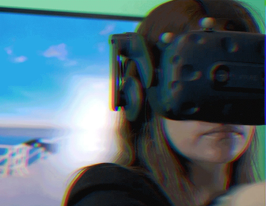 Close-up of woman using VR headset for immersive virtual environment exploration in bright room