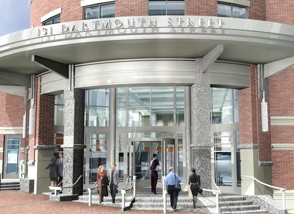 Rendering of Building entrance with granite columns, glass doors, and people entering 131 Dartmouth Street