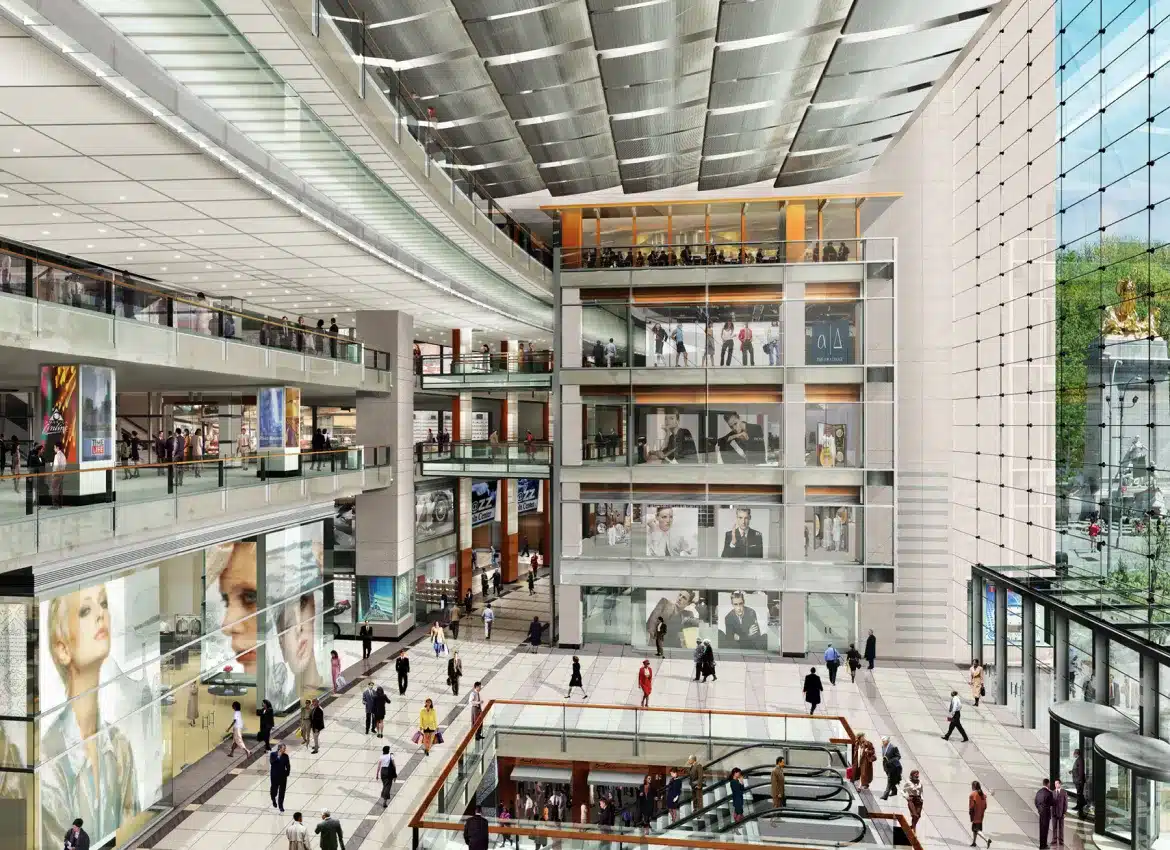 Multi-level shopping mall interior with escalators, large windows, and busy shoppers