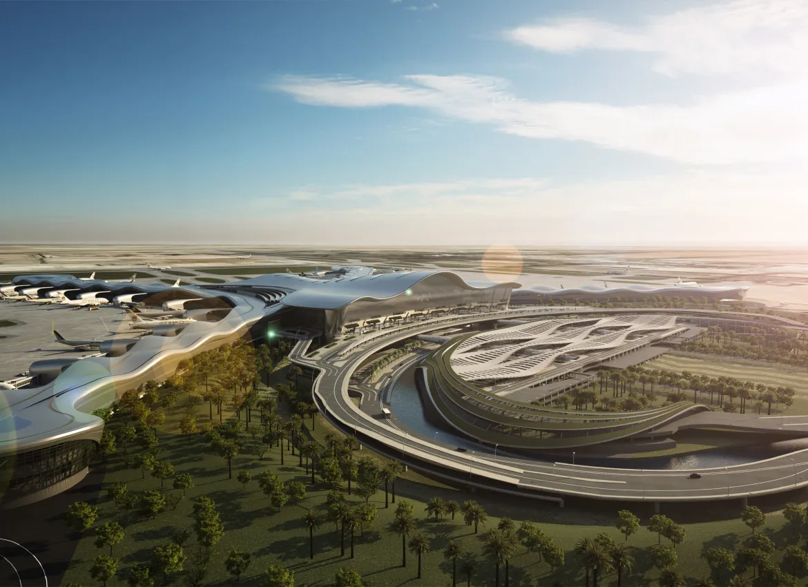 Aerial view of futuristic airport terminal with flowing rooflines and surrounding palm tree landscaping