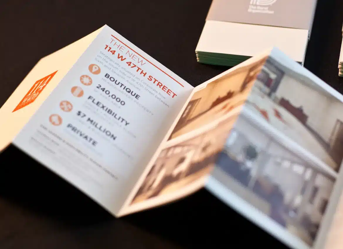 Open brochure showcasing commercial real estate details with typography and building interior photographs