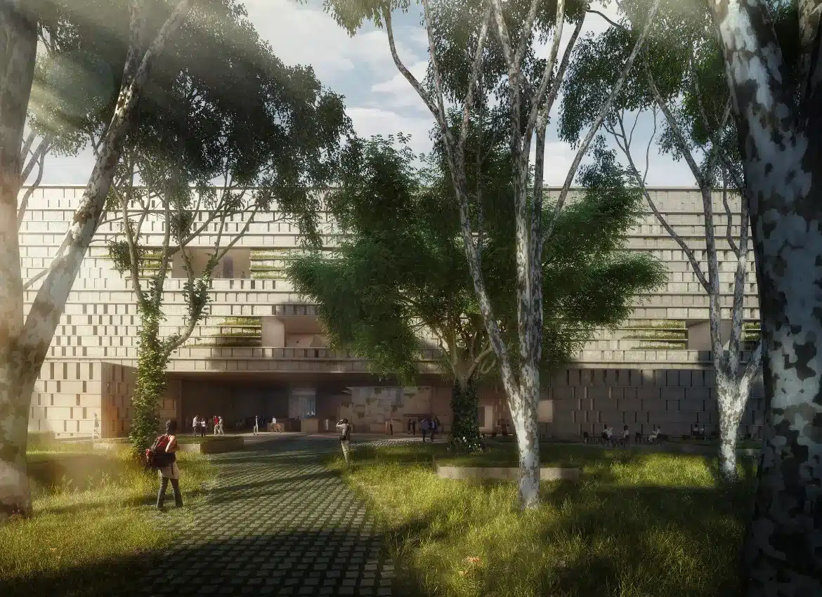 Contemporary museum building surrounded by tall trees and landscaped park with walking paths