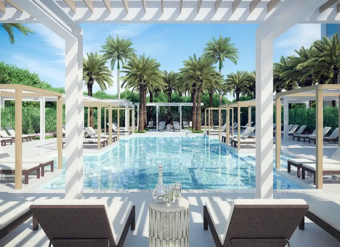 Luxury poolside rendering of cabanas overlooking palm trees with crystal-clear blue water under sunny sky