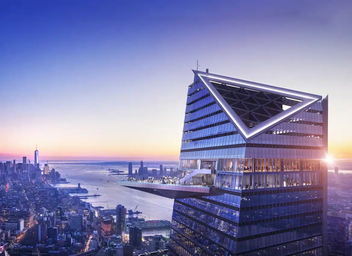 Edge observation deck rendering at Hudson Yards overlooking Manhattan skyline during colorful evening sunset