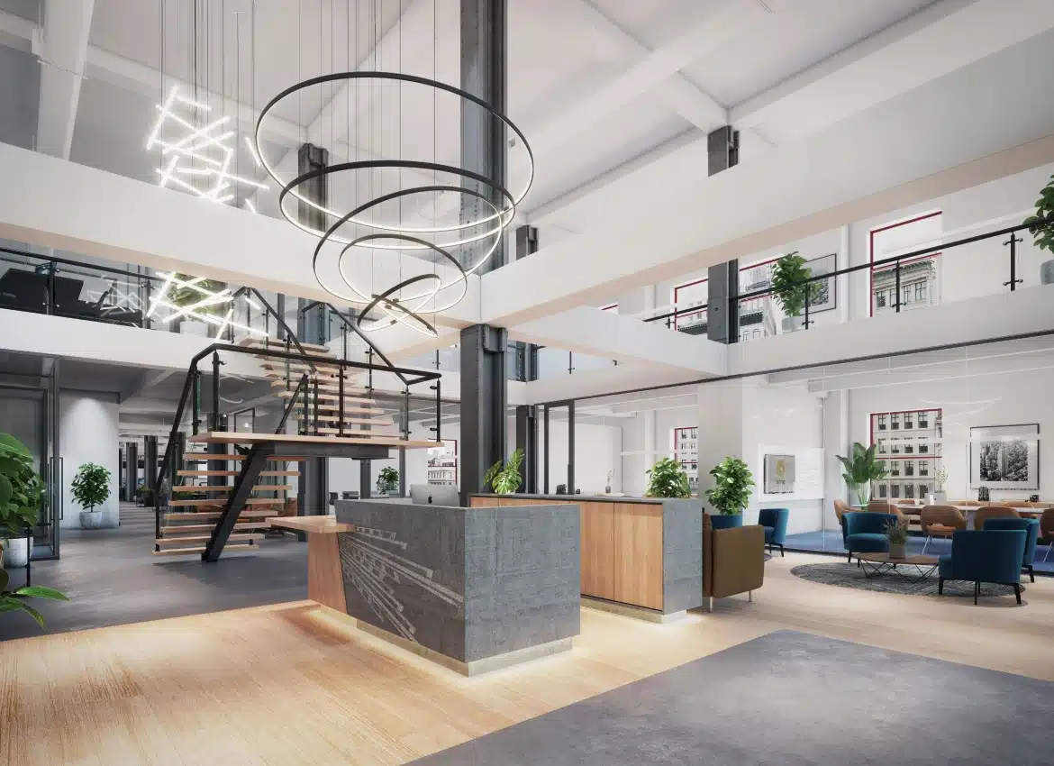 Spacious modern office lobby featuring contemporary staircase, reception desk, and artistic circular light fixtures
