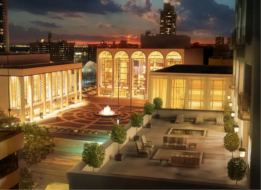 Night view of Lincoln Center showcasing elegant buildings, central fountain, and city skyline background