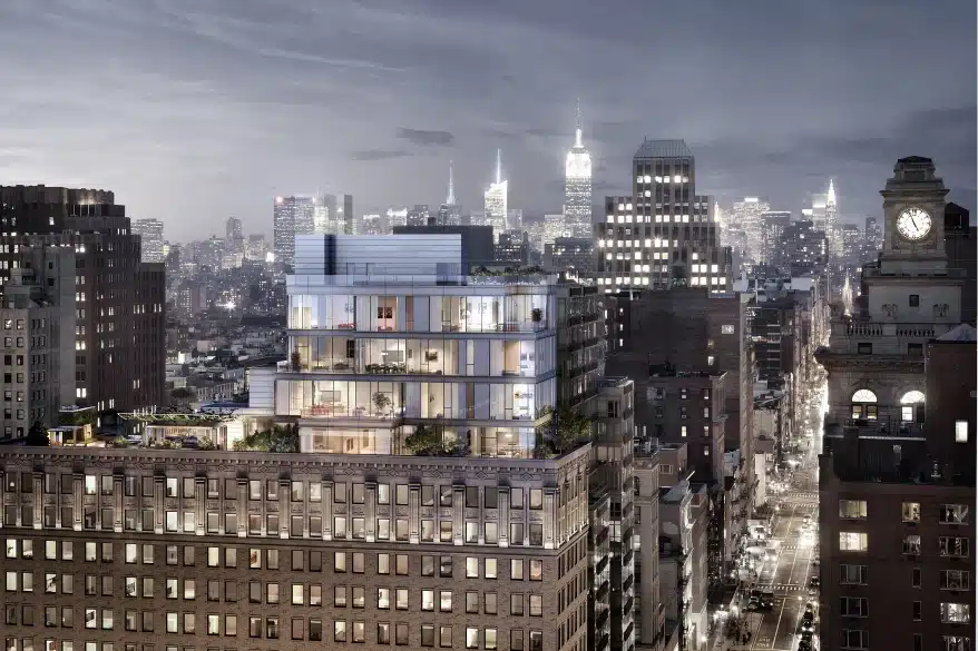 Luxury penthouse atop historic building with glass walls overlooking iconic New York City skyline