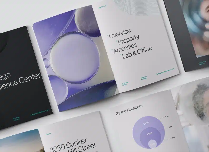 Open brochures displaying property overview, amenities, and lab office details with clean design