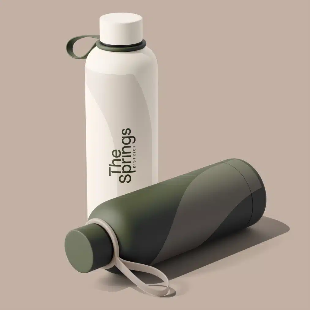 Branded reusable water bottles featuring The Springs District logo with sleek modern promotional merchandise design