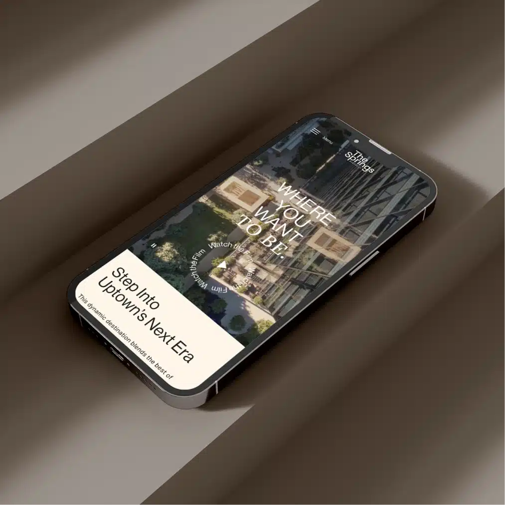 Mobile website mockup showcasing The Springs District homepage with luxury mixed use development branding and messaging