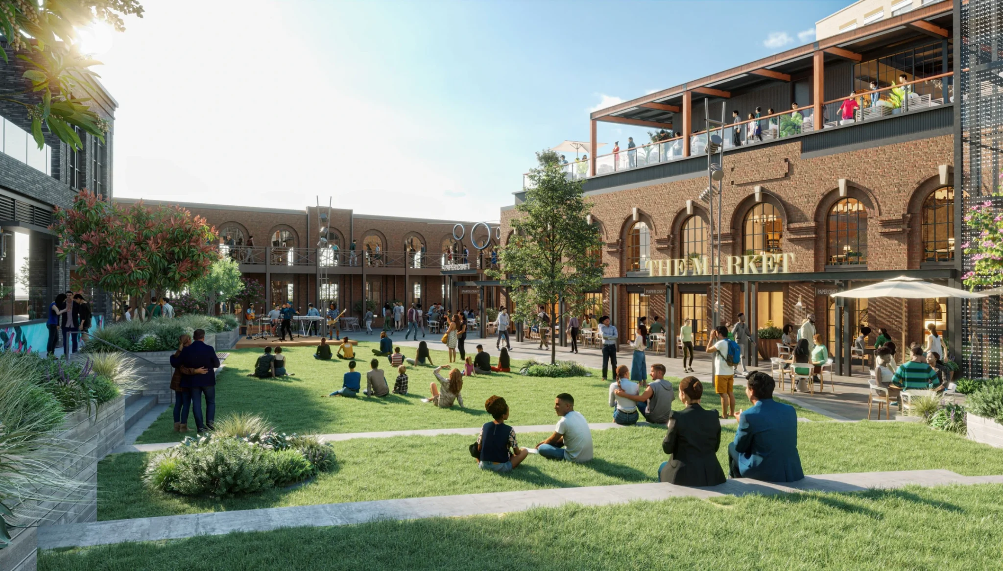 Mixed-use development courtyard offering outdoor seating, dining, green space, and community entertainment
